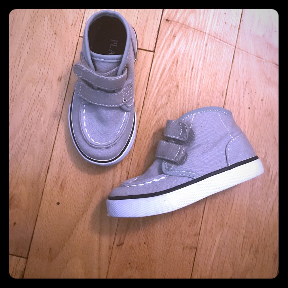 Children place shoes