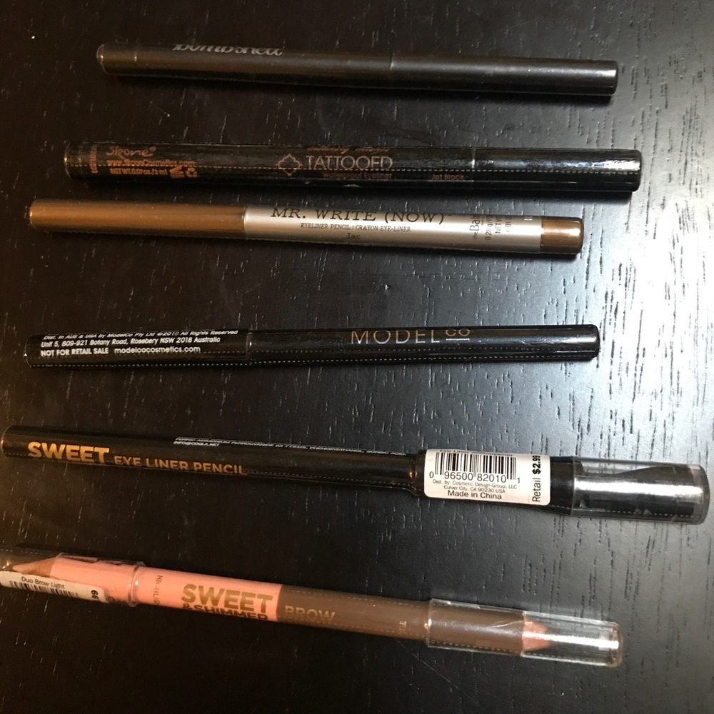 Assorted eye liners and brow pencils