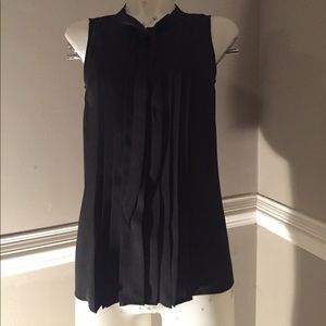 Pleated button up blouse with scarf.