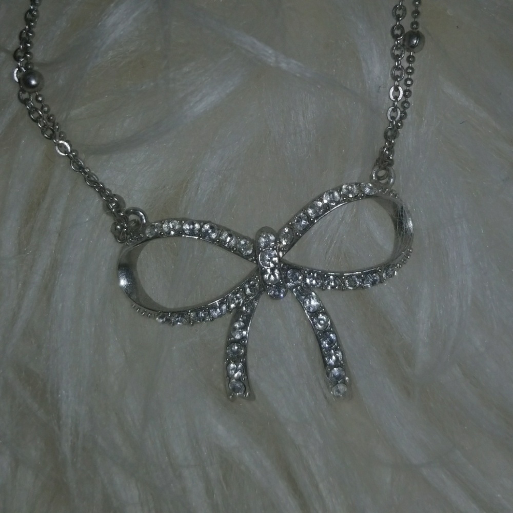 Silver and crystal bow necklace