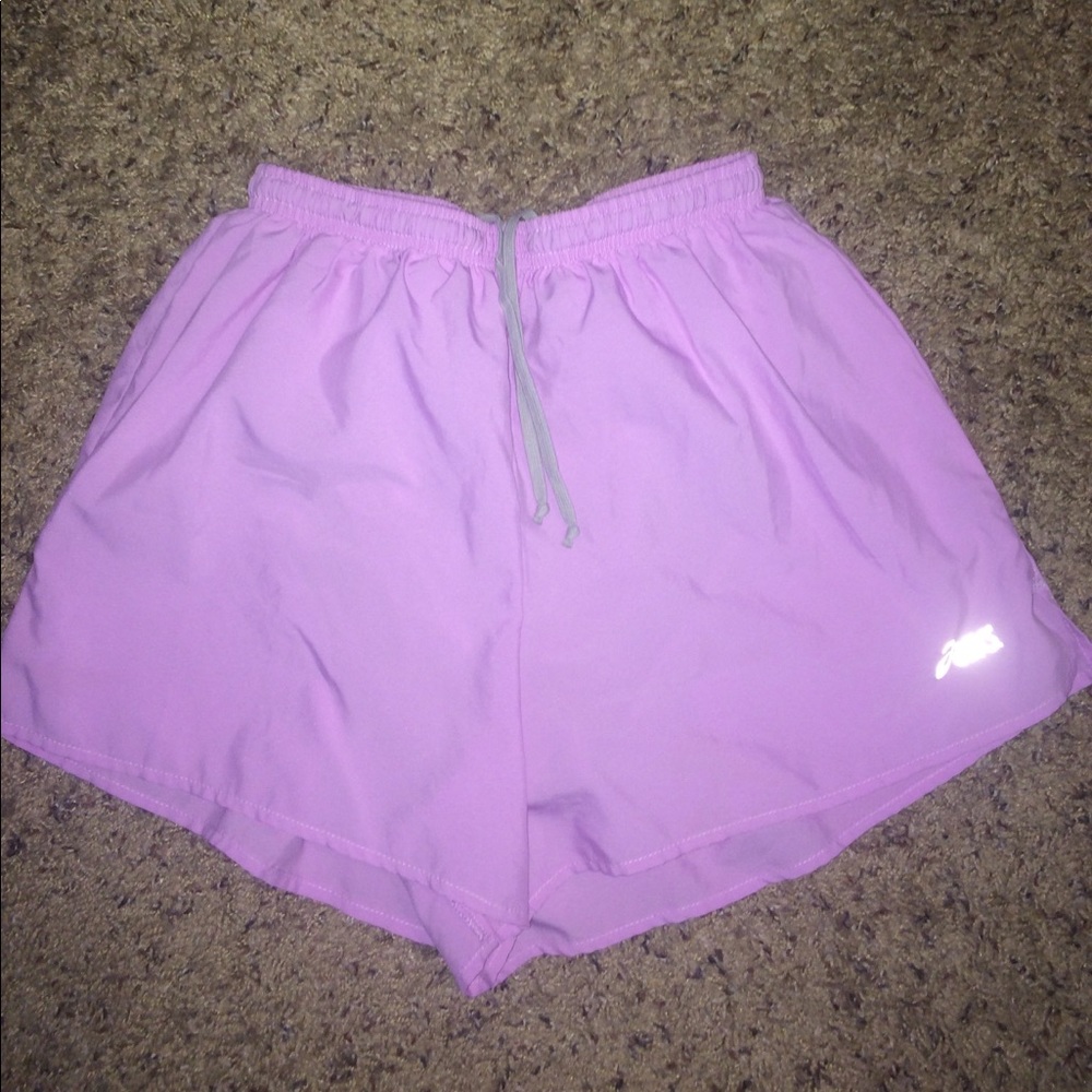 Purplish pink Asics running shorts