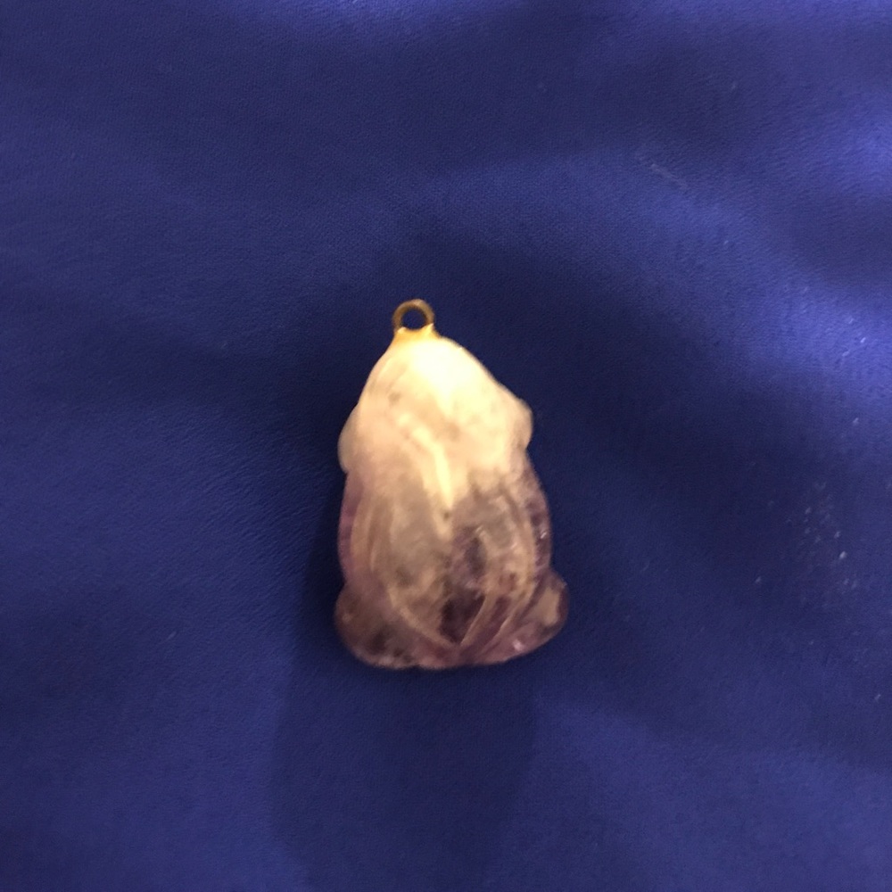 Stone frog pendant.