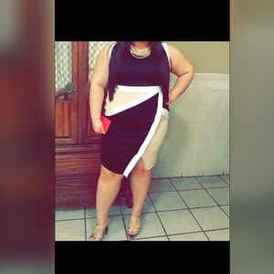 Professional curve accentuating dress.