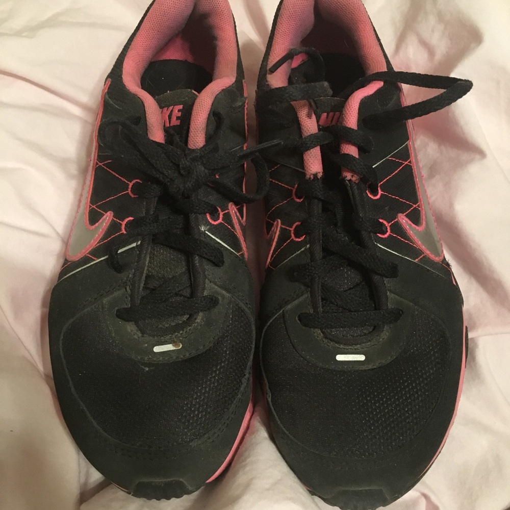 Black and pink Nike shoes