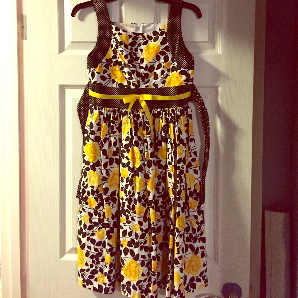 Yellow rose and black and white polka dot dress