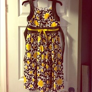 Yellow rose and black and white polka dot dress