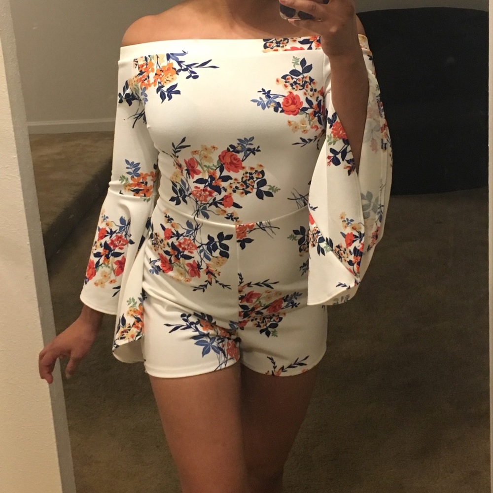 New white romper with flowers.