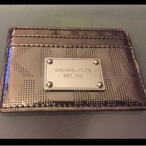 Michael Kors metallic silver ID wallet.