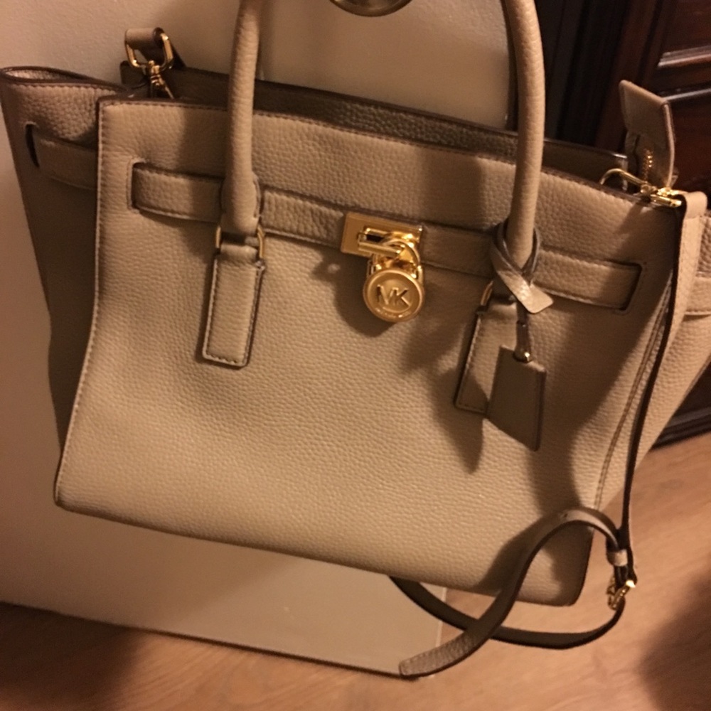 Authentic Michael Kors purse and matching wallet