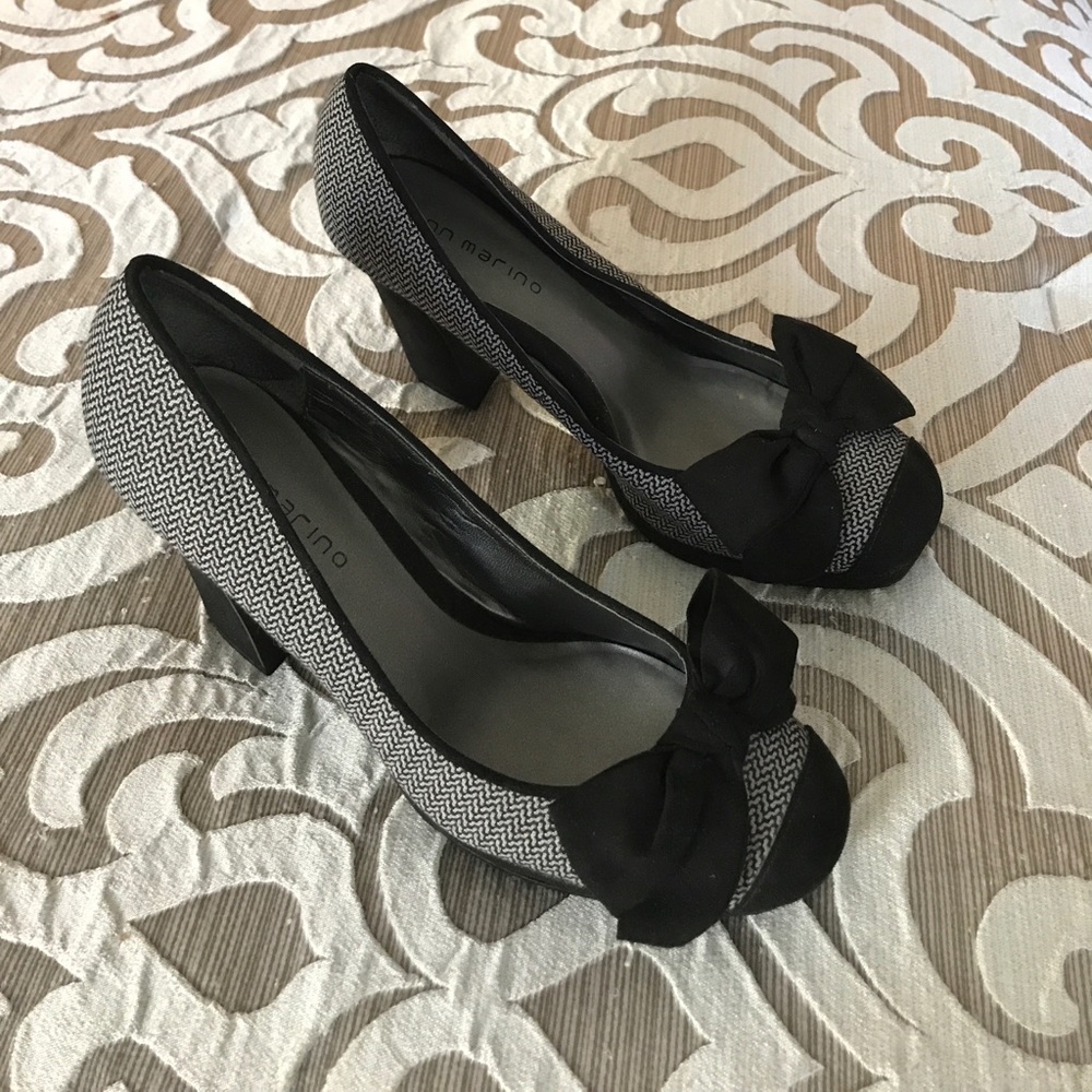 Adorable, new, never worn heels accented with bows