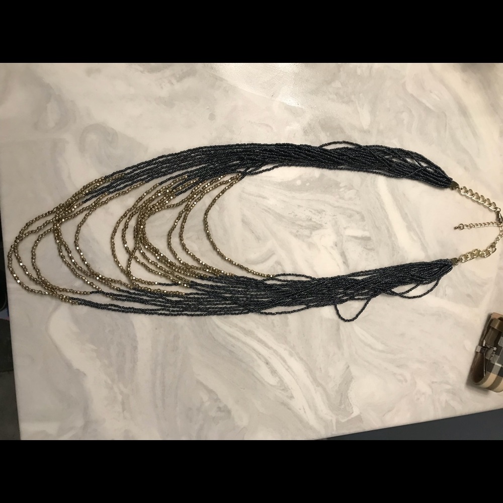 NWOT long gold and charcoal layered necklace.
