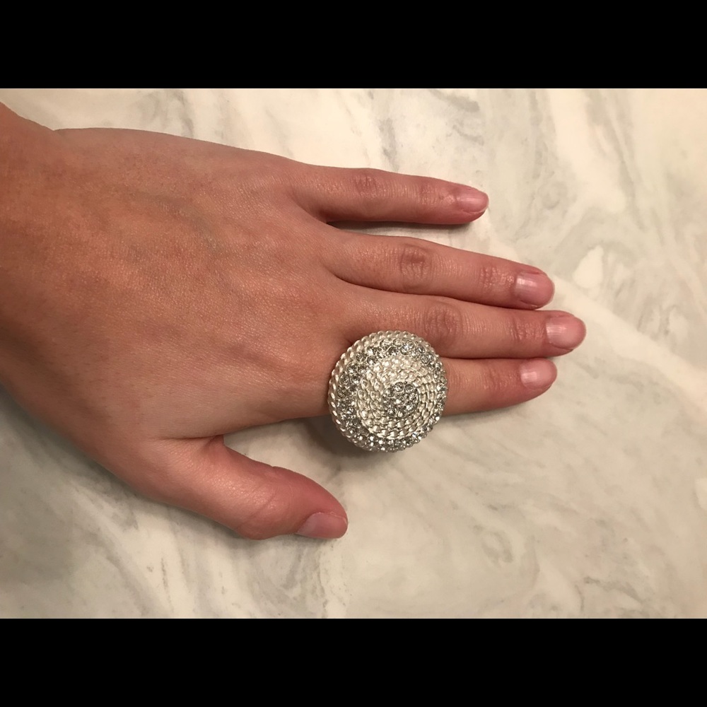 Silver bling ring with stretchy band.