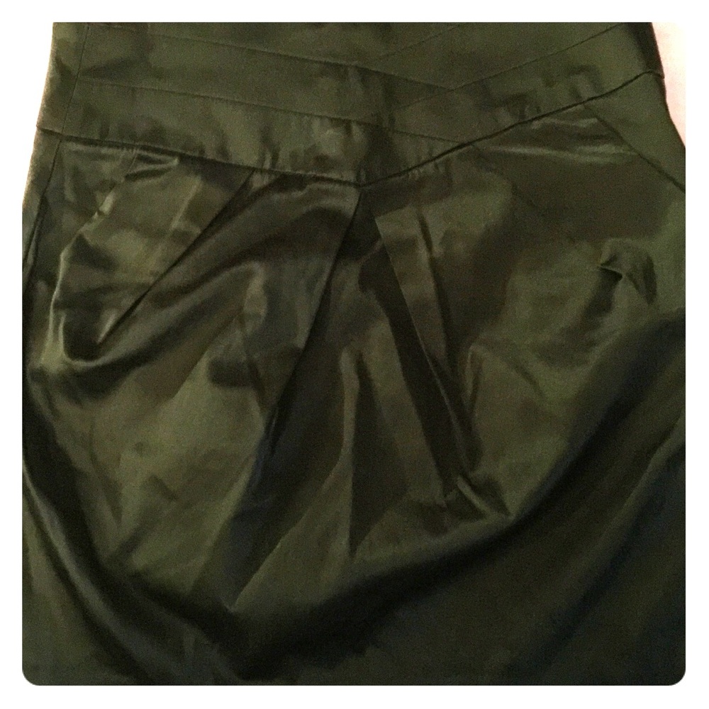 Black satiny skirt. Nice design. Classy.