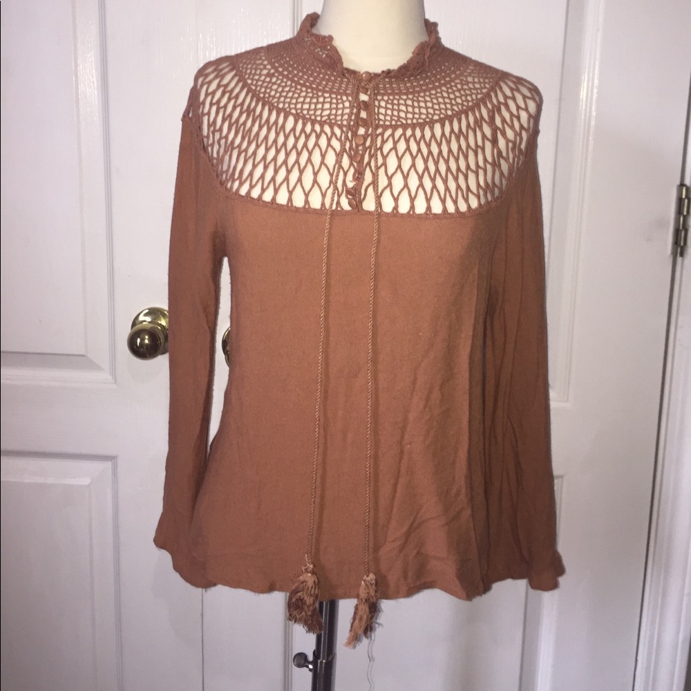 Burnt orange colored lace blouse