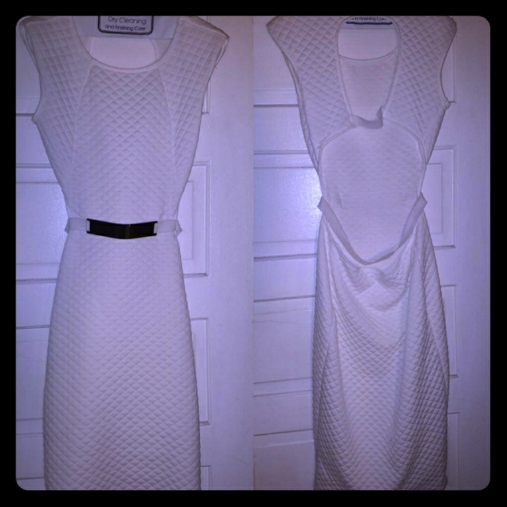 All white dress w/gold belt.