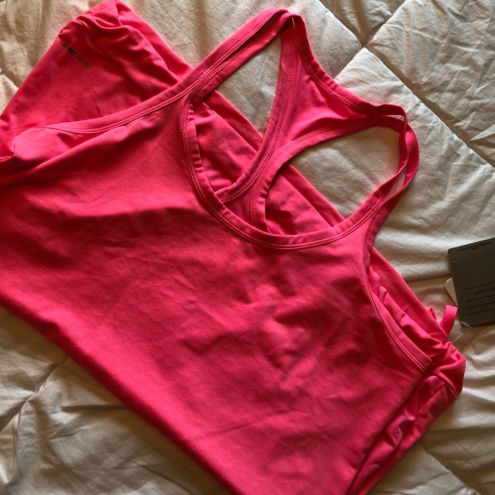 Bright pink Reebok tank top