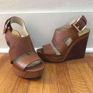 Brown leather wedges by Michael Kors