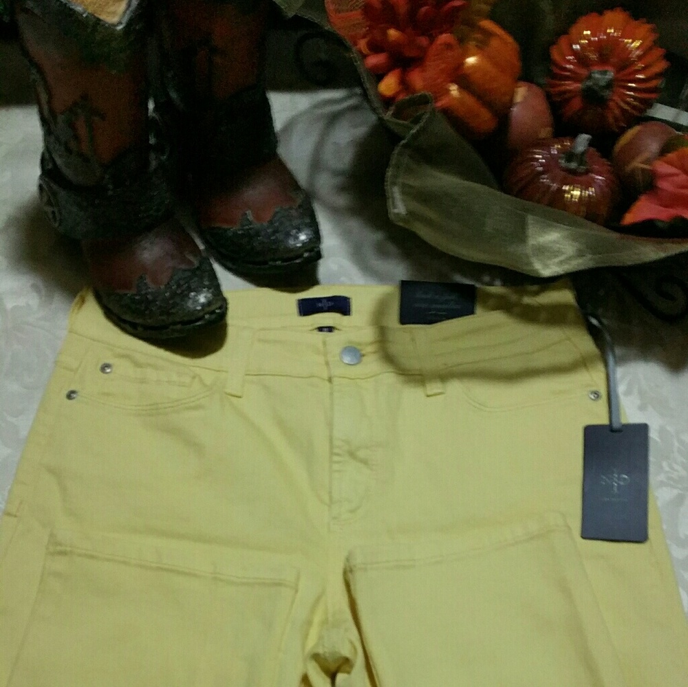 A pair of yellow NYDJ SKINNY JEANS
