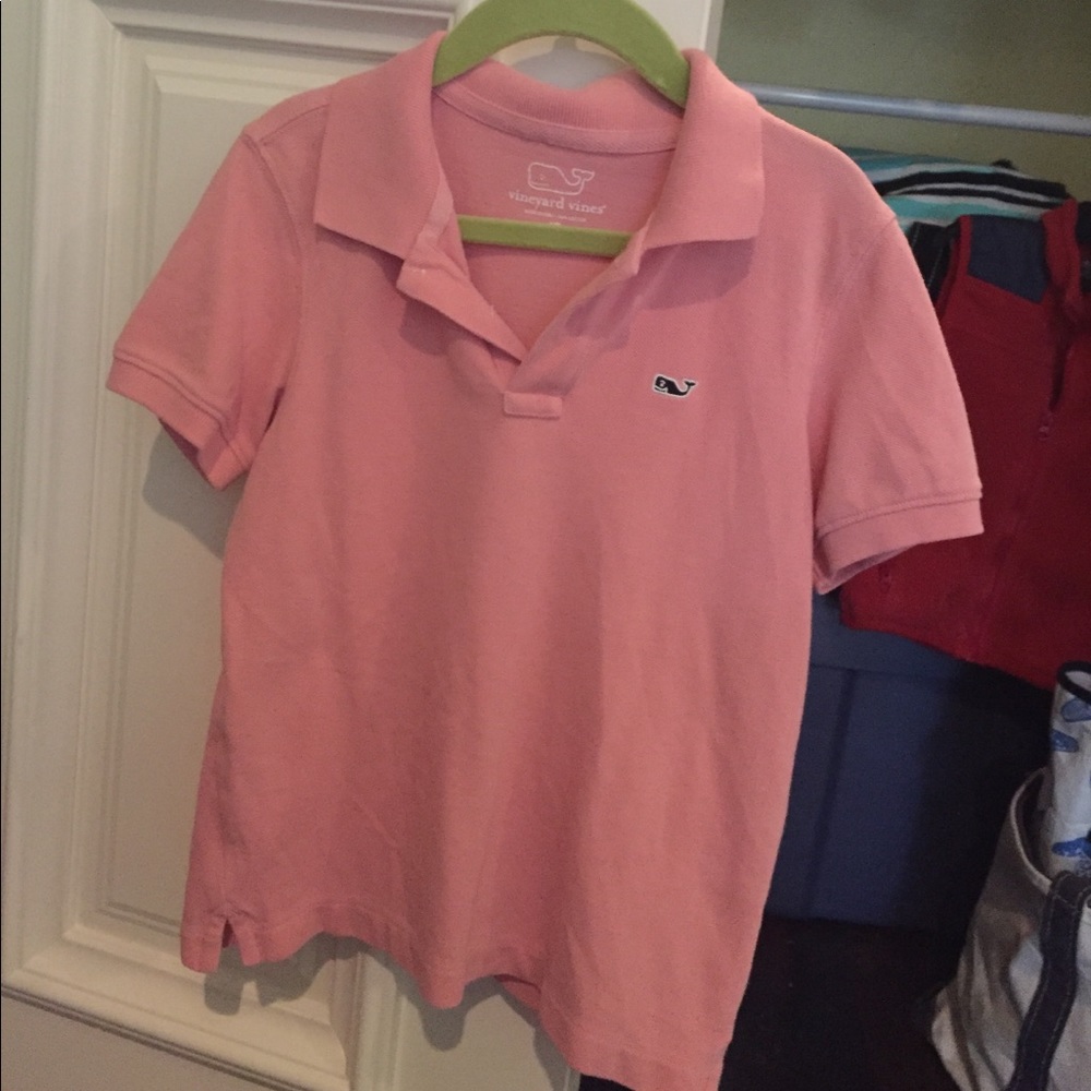 A light pink vineyard Vines polo shirt.