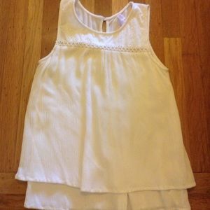 White flowy shirt. Super comfortable. Never worn