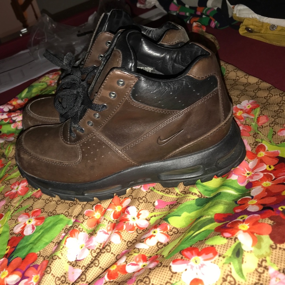Brown and Black Nike boots