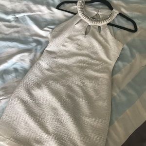 White bodycon dress with high neckline