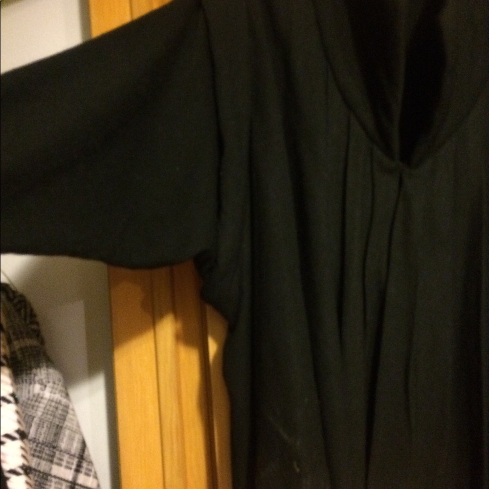 Black jacket, long sleeved/cape-like sleeve