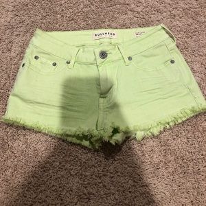 Low rise stretch denim neon green shorts