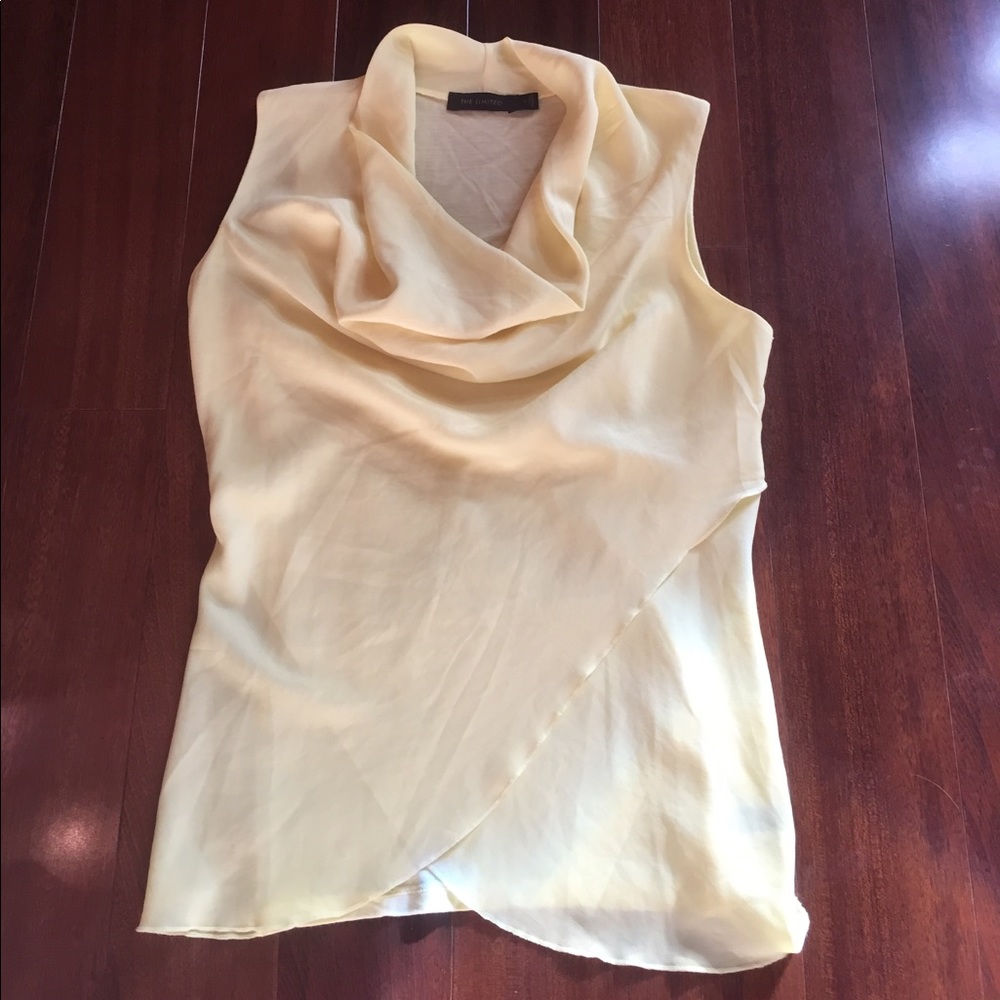 Sleeveless bright yellow cowl neck blouse.