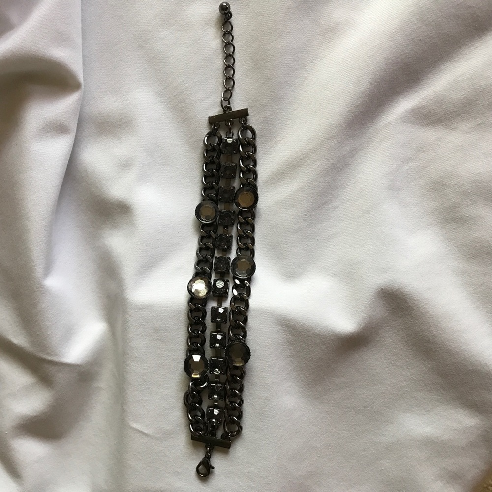 Dark stones and dark chain bracelet.