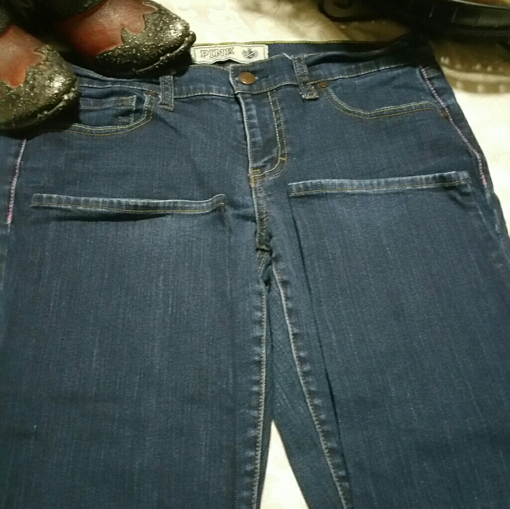 A pair of Pink skinny jeans by Victoria Secrets