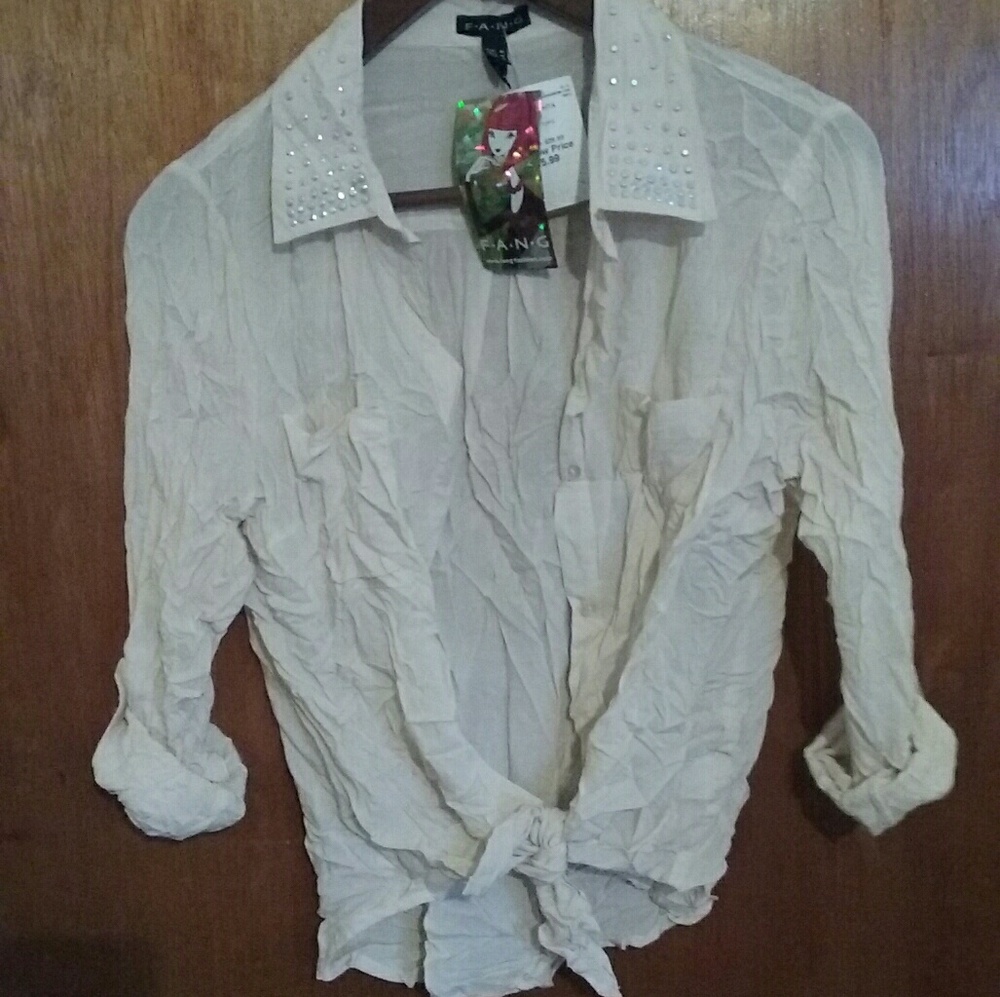 Sheer shirt with a knot in the front. Ivory color.