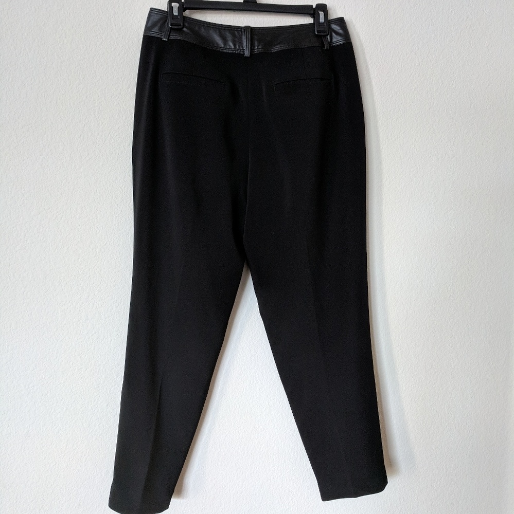 Black dress pants, says size 4 fits like a 9