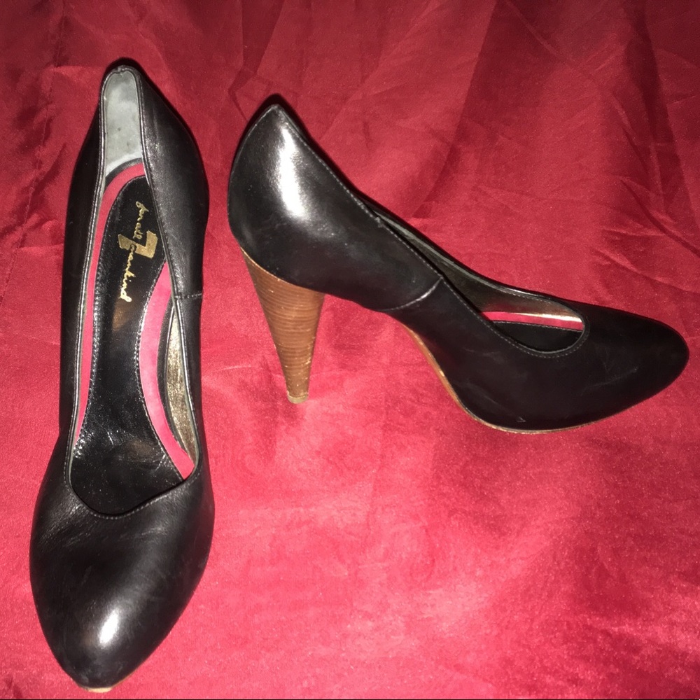 Black heels. Wooden heel. About 4 inches.