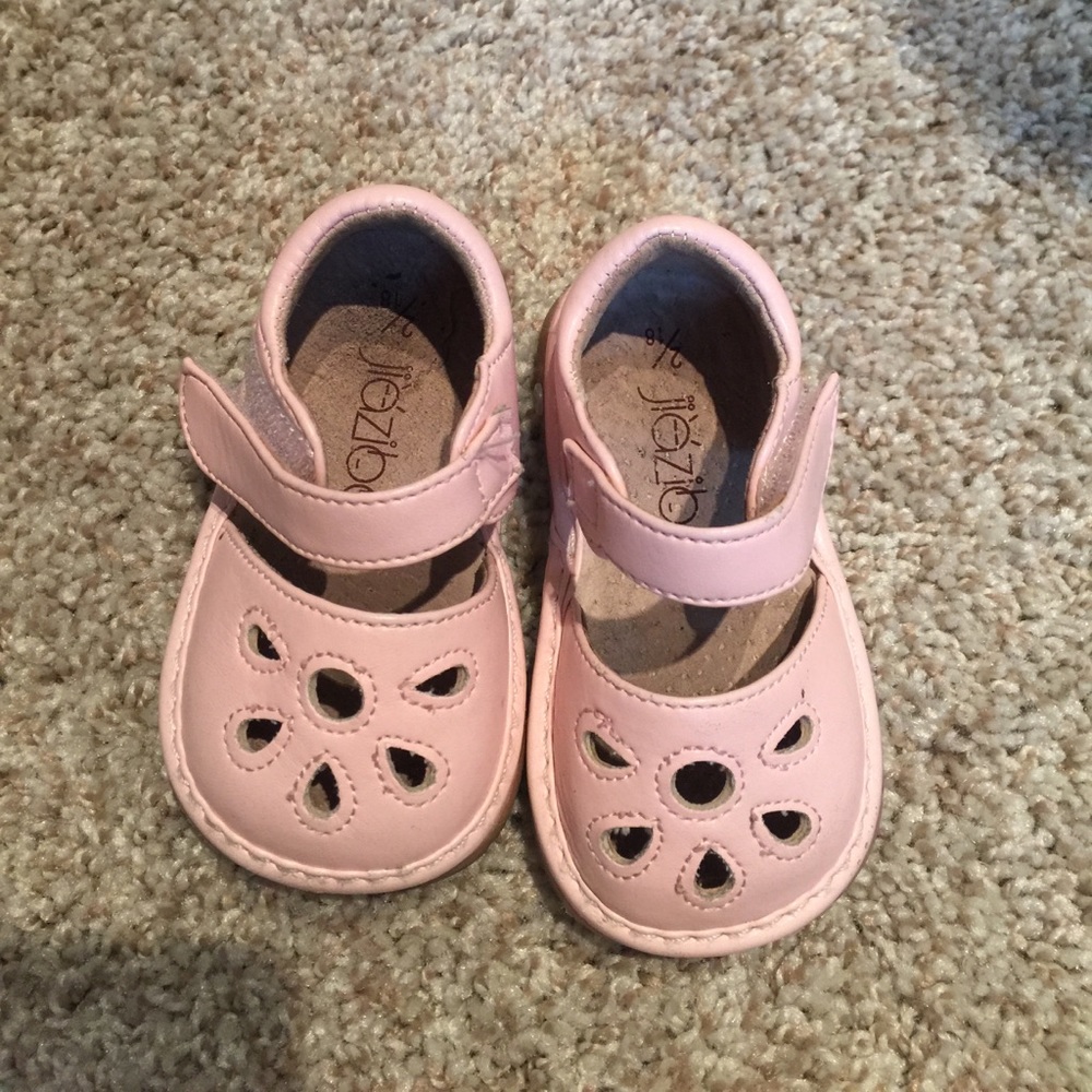 Size 2 pale pink squeaker shoes. First Walker