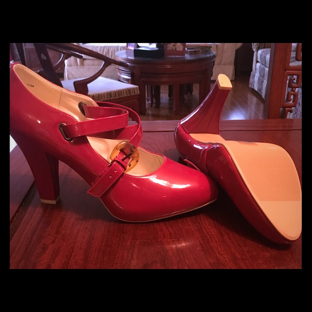Red high heeled paten leather shoes