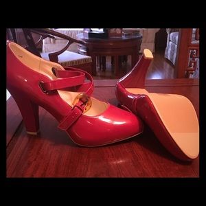 Red high heeled paten leather shoes