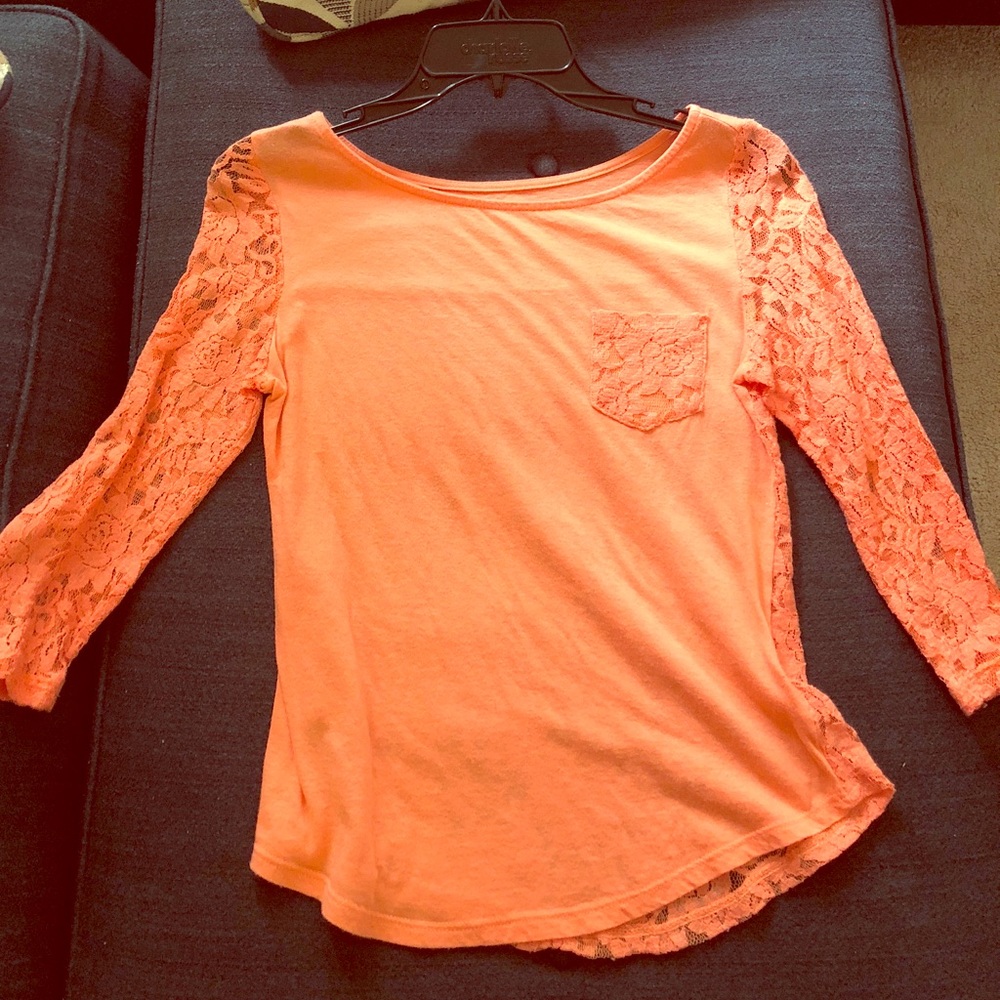 Top’s sleeves and back is all lace. Super cute!