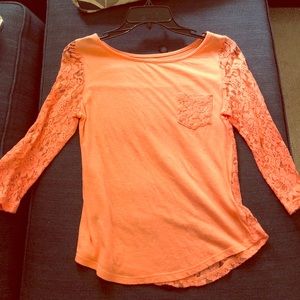 Top’s sleeves and back is all lace. Super cute!