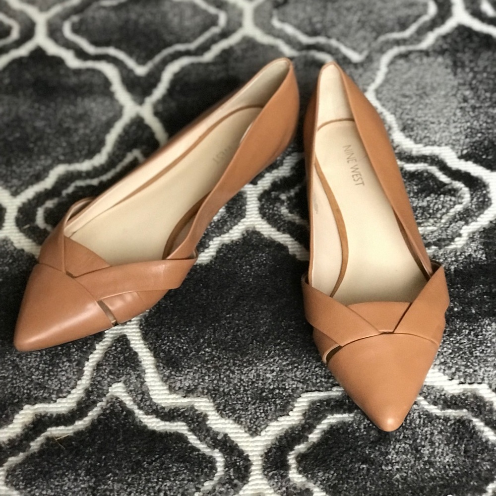 Nine West pointed toe flat with a low box heel.