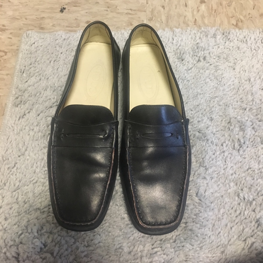 Black Tod's Leather Penny Loafers.