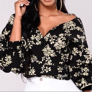BRAND NEW. Floral wrap top.