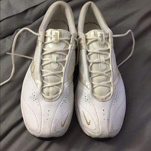 Women’s white and gold Nike sneakers tennis shoes