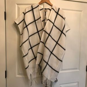 White plaid poncho.