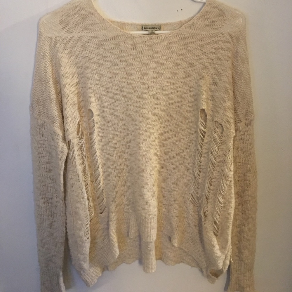 Distressed cream sweater