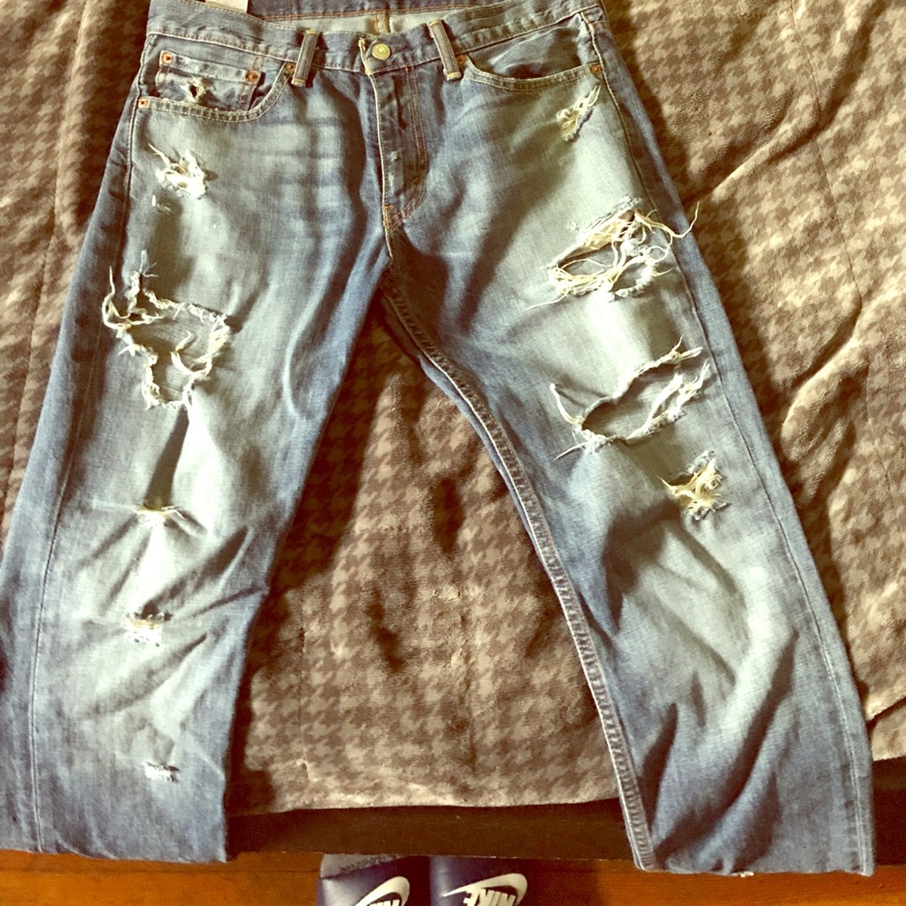 Levi 511 distressed jeans.