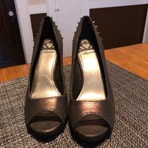 Metallic bronze like heel with pointed studs.