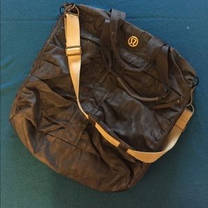 Grey lululemon workout bag with lots of pockets