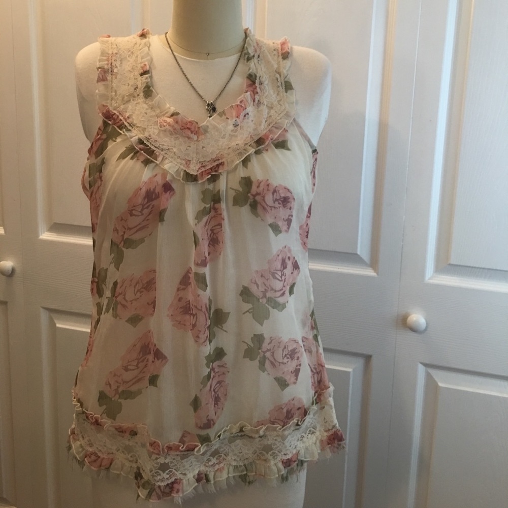 Very dainty looking sheer tank.