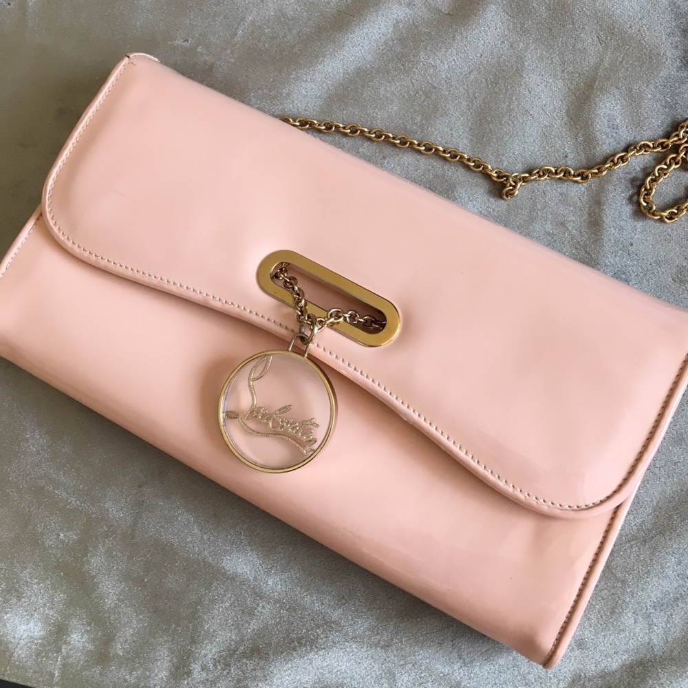 Cristian Louboutin baby pink clutch bag